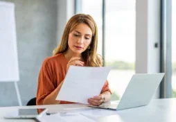 Woman looking at her credit report.